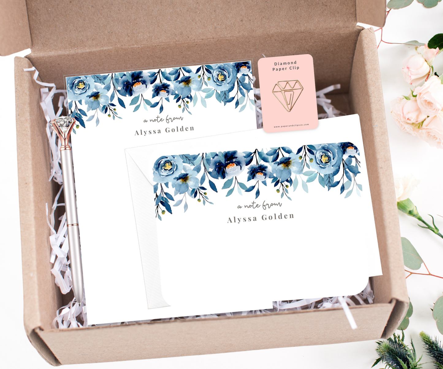Personalized floral stationery gift set. Comes with a large floral notepad and a set of 12 floral notecards, diamond shaped paper clip and silver diamond pen. Put a smile on someone's face with this one of a kind gift set for any occasion.